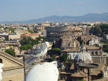 High angle view of buildings in town against sky