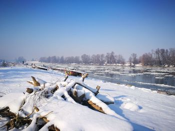 Scenic view of frozen lake against clear sky