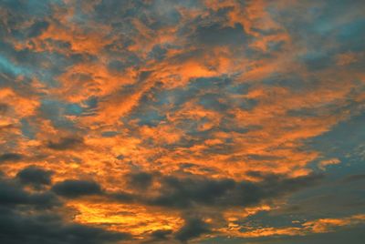 Low angle view of cloudy sky at sunset