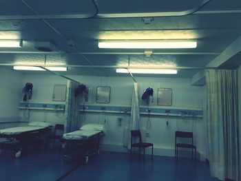 Interior of illuminated hospital ward