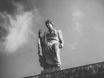 Low angle view of statue against sky