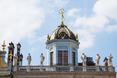 Low angle view of statue of building against sky