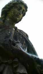 Low angle view of statue against sky