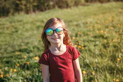 Portrait of smiling girl wearing sunglasses