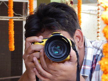 Portrait of man photographing 