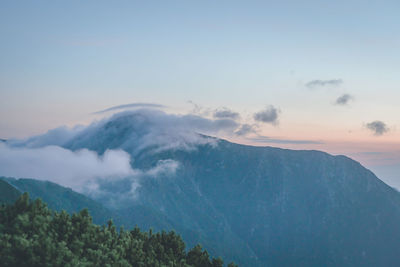 Scenic view of mountains against sky during sunset