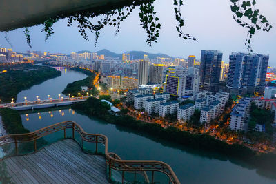 High angle view of city by river