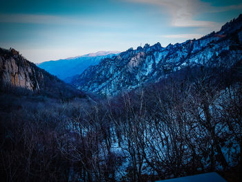 Scenic view of snowcapped mountains against sky