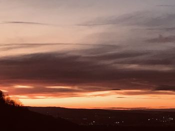 Scenic view of silhouette landscape against sky during sunset