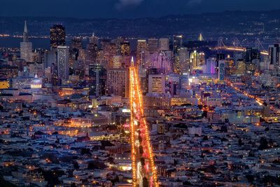 High angle view of illuminated cityscape at night