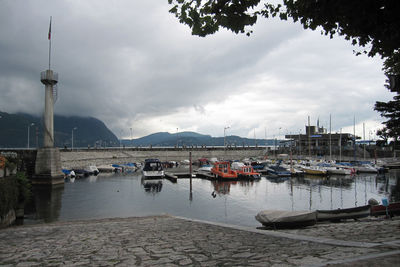 Boats moored at harbor