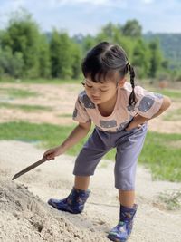 Full length of woman standing on land