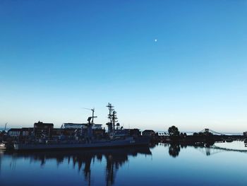 Scenic view of lake against clear blue sky