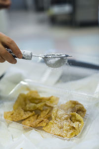 Close-up of hand holding food