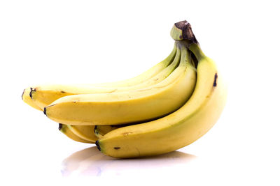 Close-up of bananas against white background