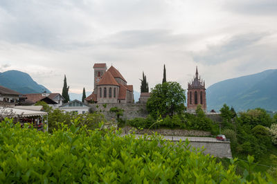 View of buildings against cloudy sky