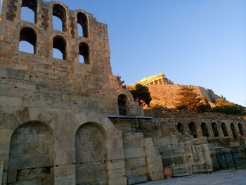 Low angle view of old ruin building against sky