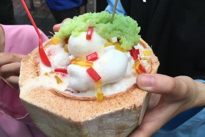 Close-up of hand holding ice cream