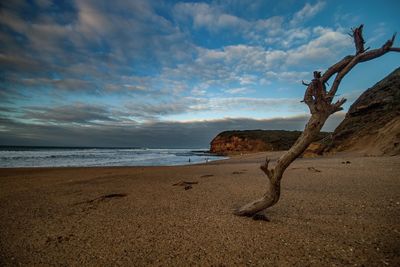 Scenic view of sea against cloudy sky