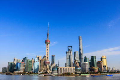 View of skyscrapers against blue sky