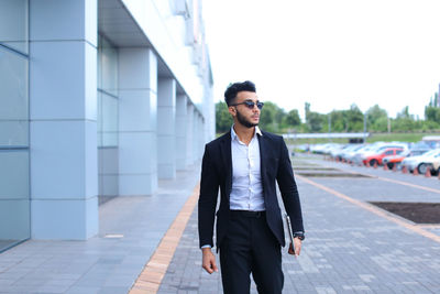 Young businessman standing outdoors