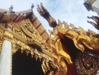 Low angle view of statue of temple against sky