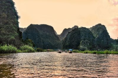 Scenic view of mountains against clear sky during sunset