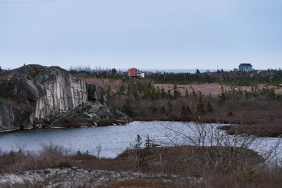 Scenic view of rocks against clear sky