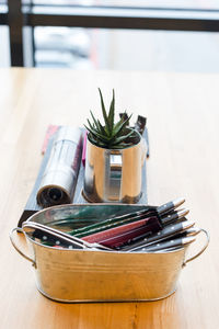 Creative serving of appliances in a restaurant, spoons, forks and knives in metal dishes.