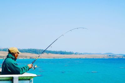 Man fishing in sea