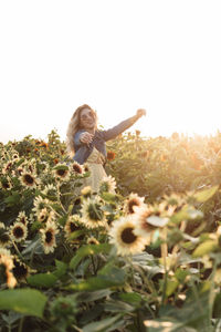 Woman on field against clear sky