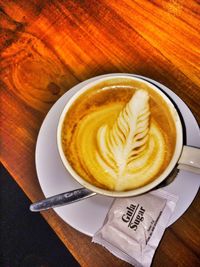 Close-up of cappuccino on table