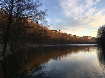 Scenic view of lake against sky during sunset