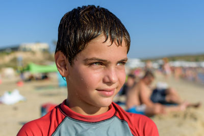 Close-up portrait of boy at the beach
