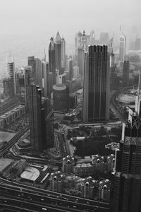 High angle view of buildings in city against sky