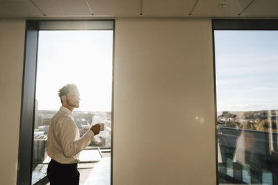 Man having coffee at office