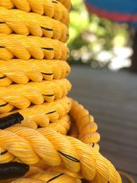 Close-up of yellow rope on table