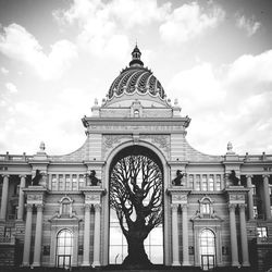 Low angle view of building against cloudy sky