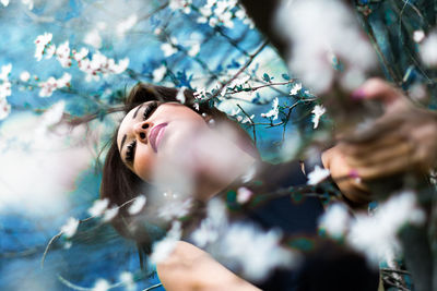 Close-up of woman hand on plant