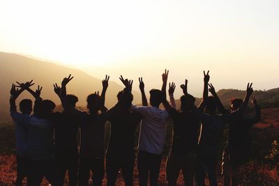 Group of people enjoying in the sunset