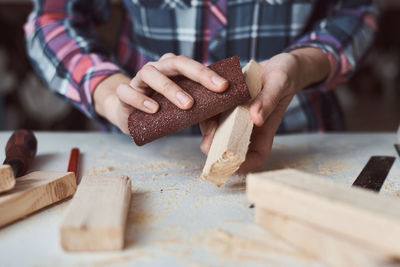 Midsection of woman preparing food on table