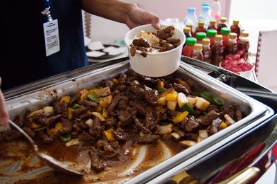 Cropped image of woman eating food