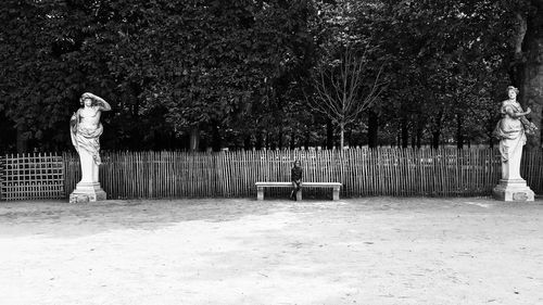 Girls sitting on bench at park