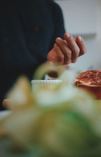 Midsection of person preparing food