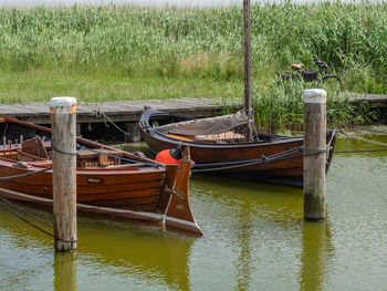 Wooden post in lake