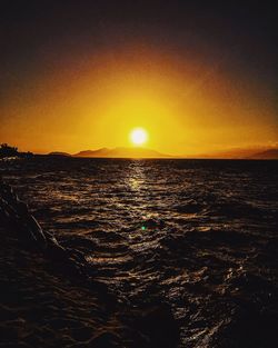 Scenic view of sea against sky at sunset