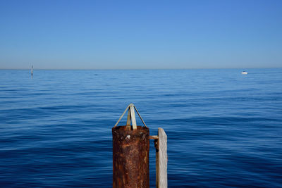 Scenic view of sea against clear blue sky