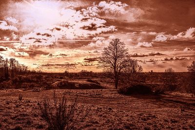 Scenic view of landscape against sky at sunset