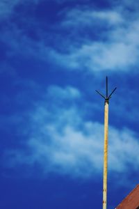 Low angle view of windmill against sky