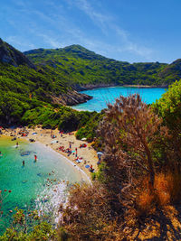 High angle view of people on beach against sky